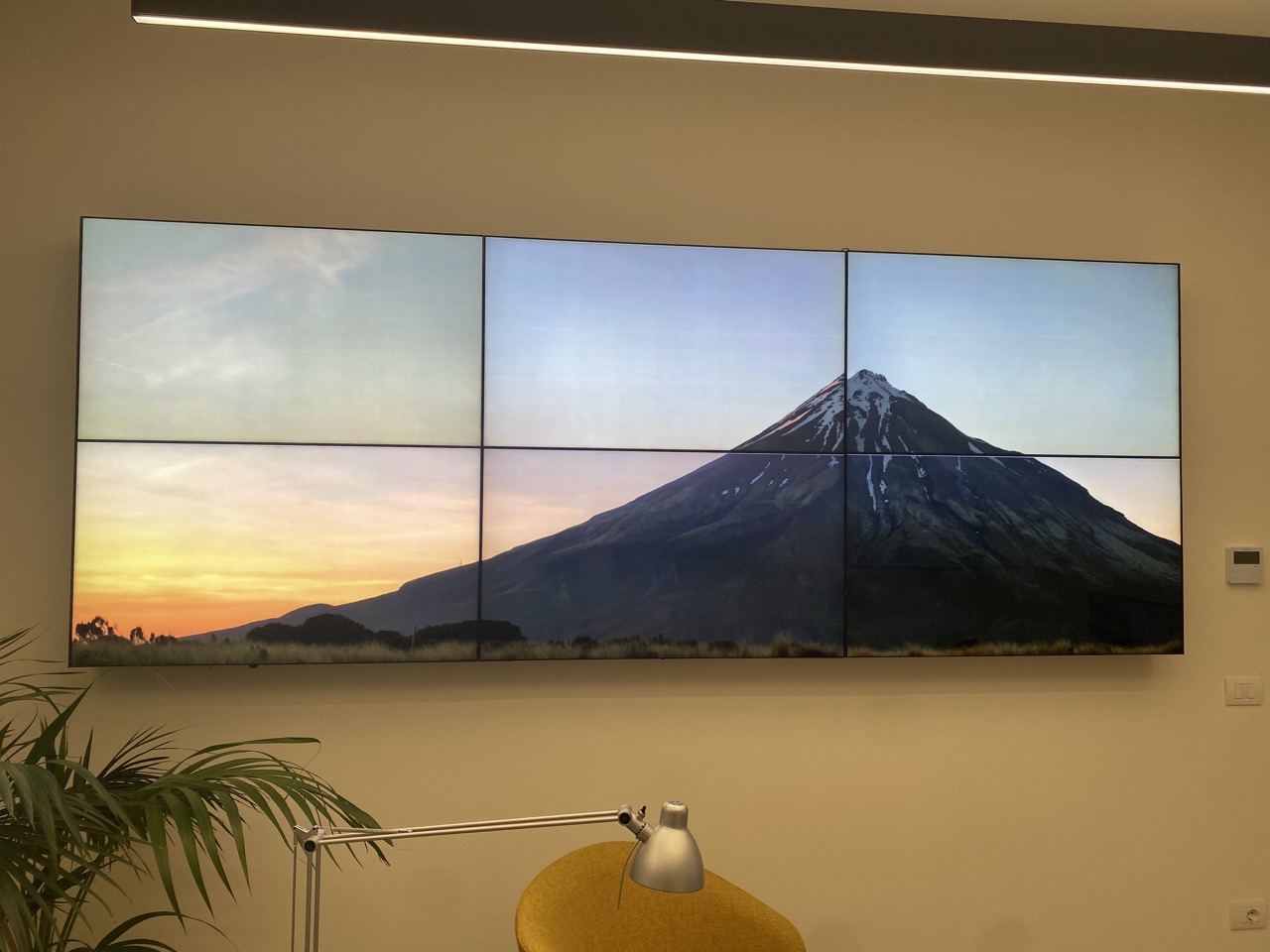 Six-screen video wall showing one photo spread across all the panels